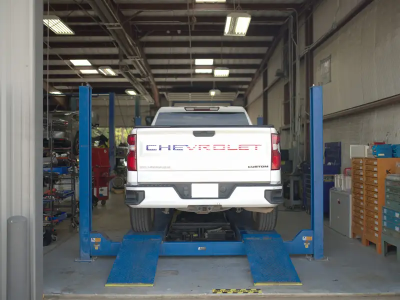 A pickup on a lift in our shop
